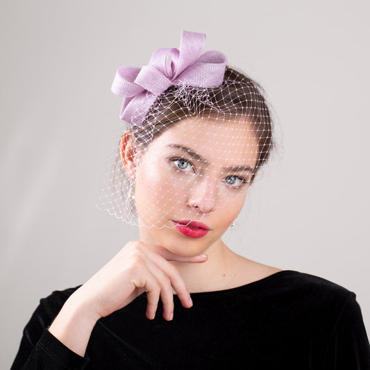 Wedding guest bow headpiece with birdcage in lilac modern veil and minimalist fascinator hair accessory in custom colours