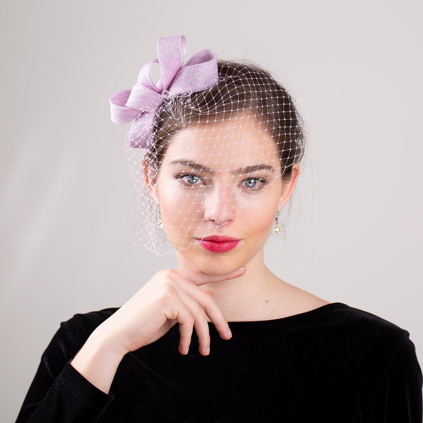Wedding guest bow headpiece with birdcage in lilac modern veil and minimalist fascinator hair accessory in custom colours