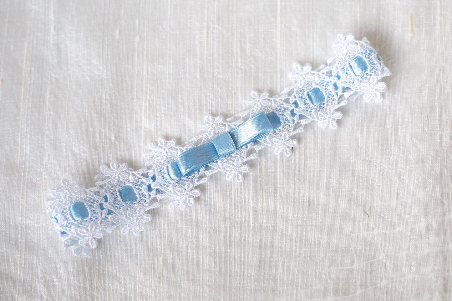Bridal bow lace garter, Wedding lace blue bow garter, something blue garter with interwoven ribbon, floral lace white garter with blue bow