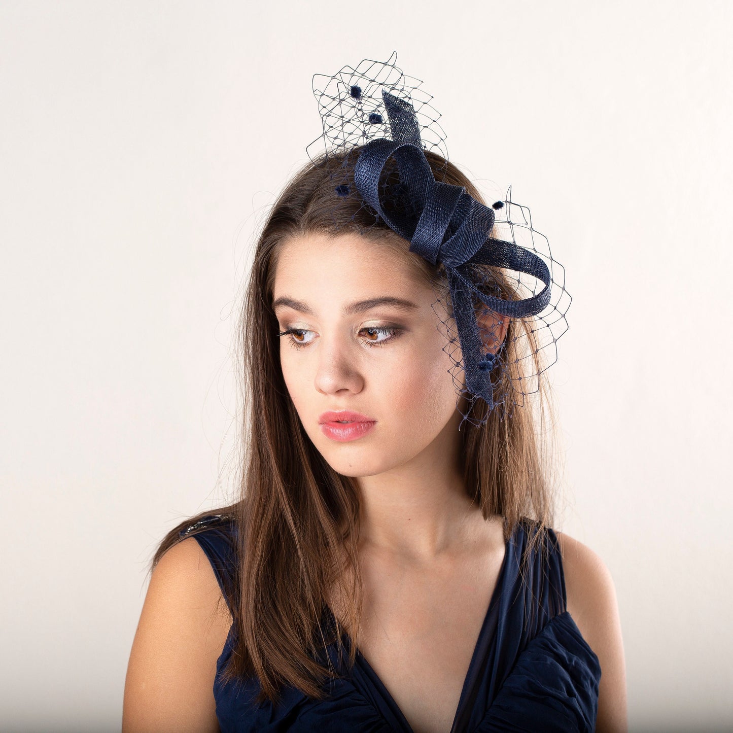 Navy bow knot fascinator with veiling, women fascinator in navy, elegant wedding guest headpiece in custom colours, mother of bride gift