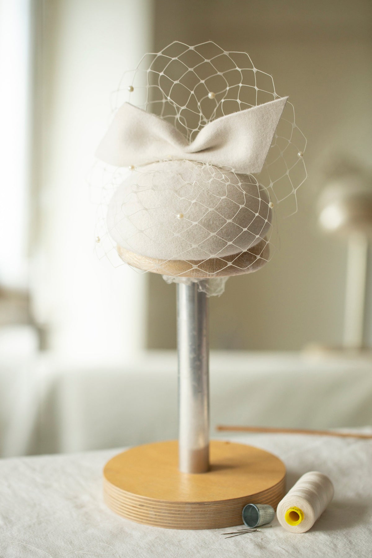 Ivory Felt Bridal Bow Pillbox Hat with Pearl-Embellished Birdcage Veil – Contemporary Wedding Headpiece