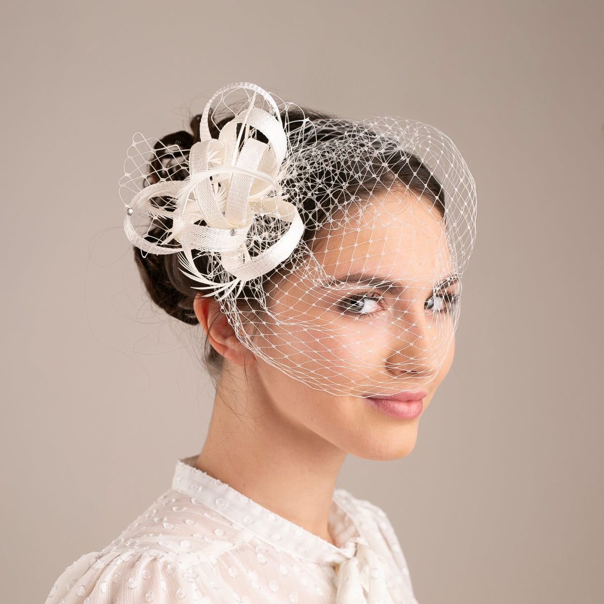 Feather & Veiling Wedding Fascinator: Romantic Bridal Headpiece in White with netting accent