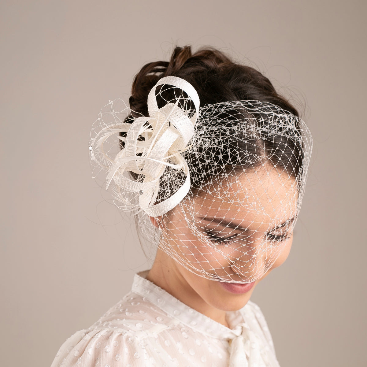 Feather & Veiling Wedding Fascinator: Romantic Bridal Headpiece in White with netting accent