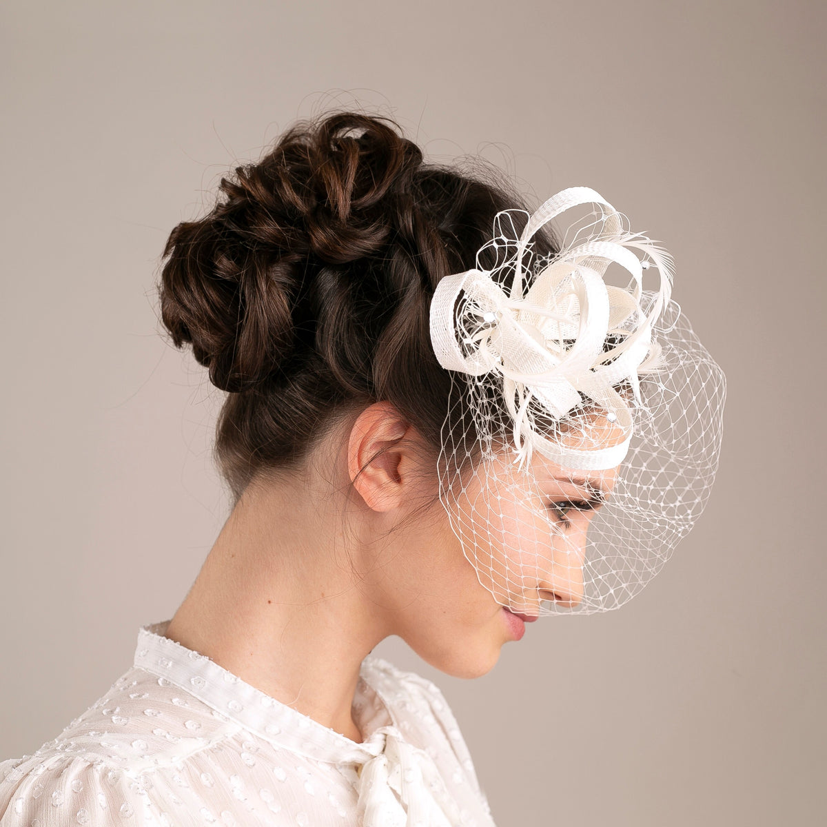 Feather & Veiling Wedding Fascinator: Romantic Bridal Headpiece in White with netting accent