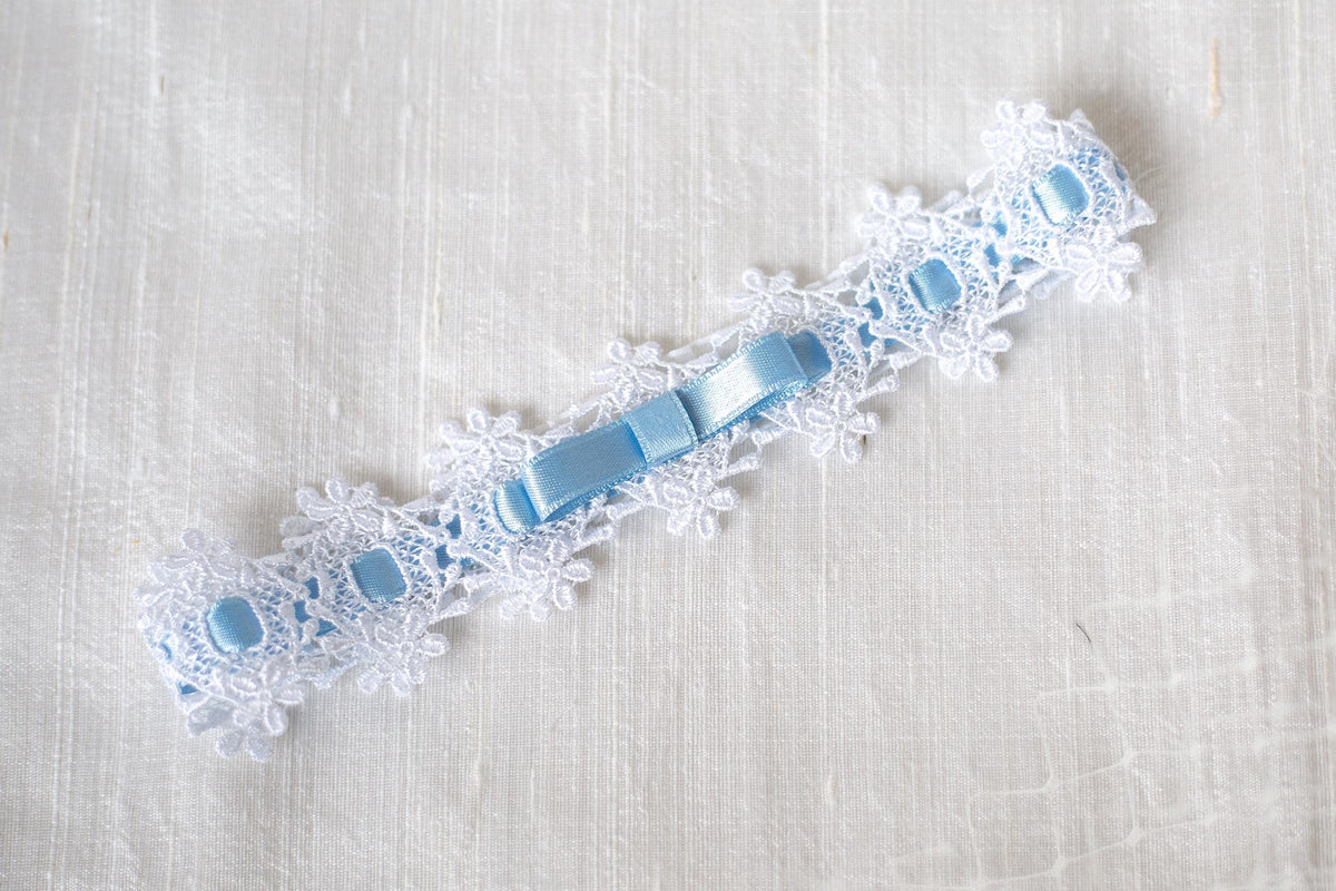 Wedding lace garter blue bow, white floral garter with interwoven ribbon for a bride