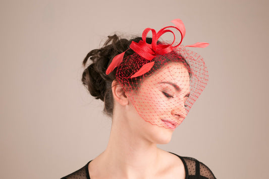 Bridesmaid millinery headpiece with feathers in poppy red